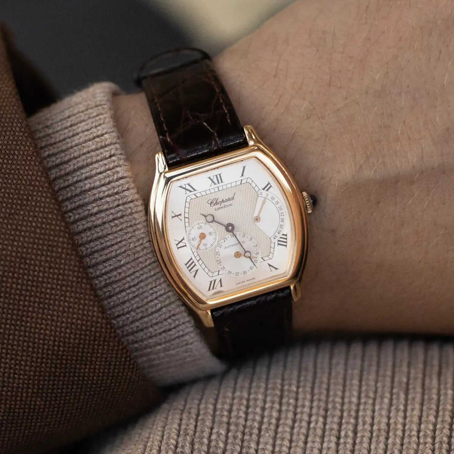 Luxury Chopard wristwatch with tonneau case and leather strap